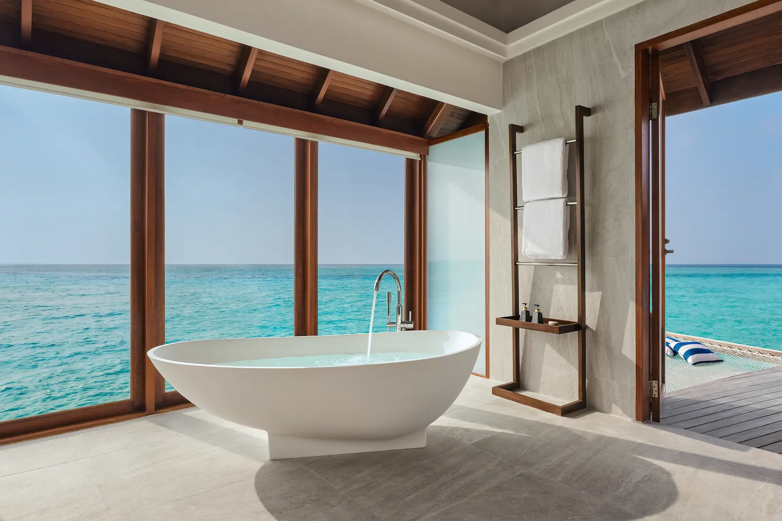 anantara dhigu maldives resort sunset over water villa bathtub