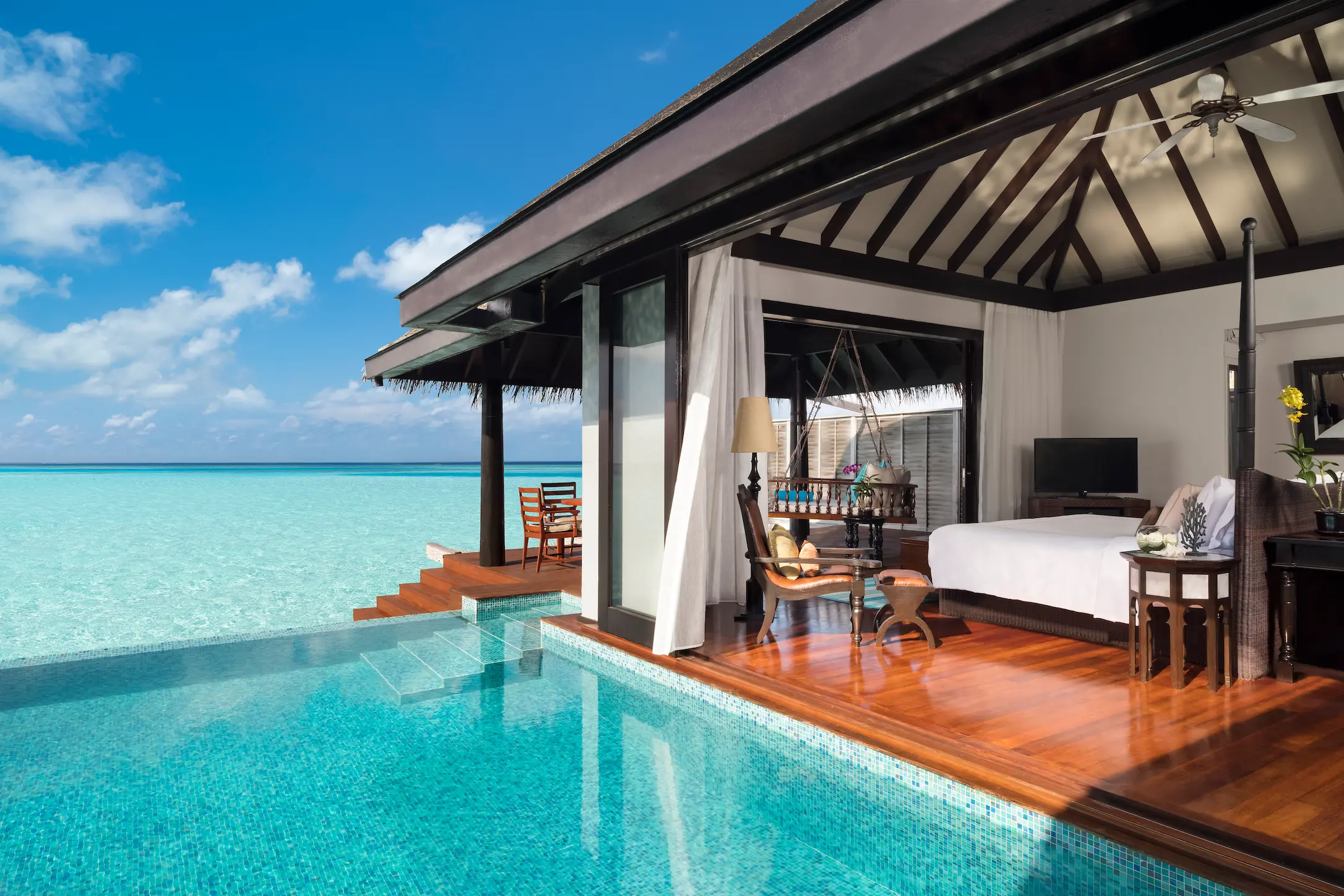 anantara kihavah maldives villas over water villa bedroom and pool view