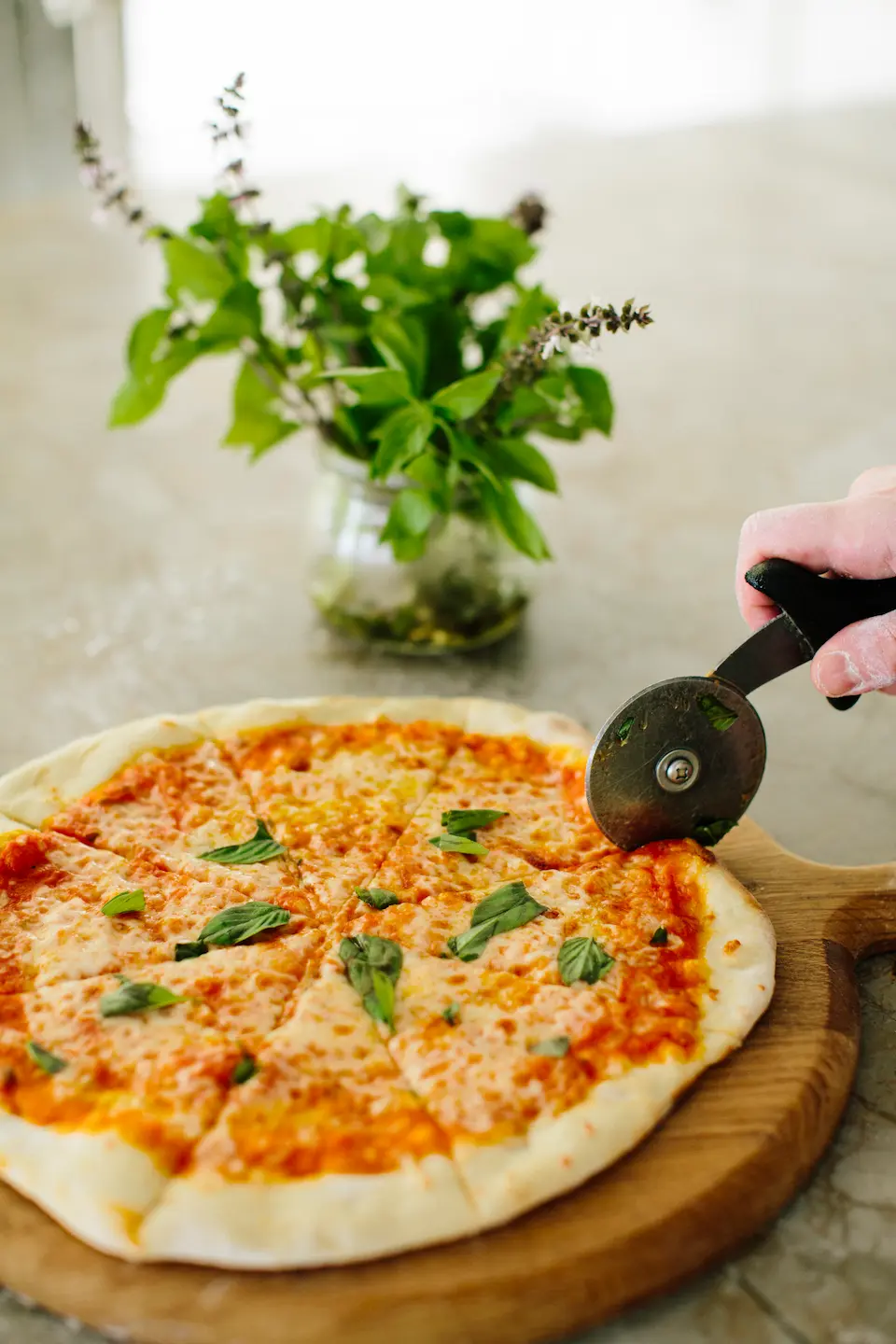 artisan pizza from the restaurant menu at anantara kihavah maldives villas presented with refined island dining style
