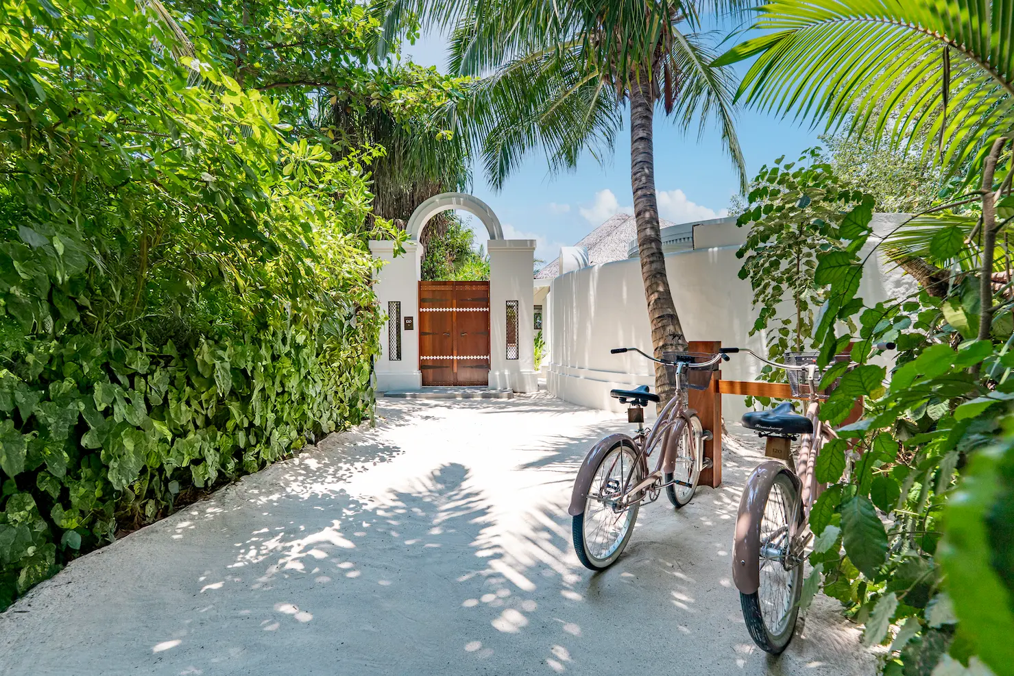 anantara kihavah maldives villas sunset beach pool villa entrance pathway