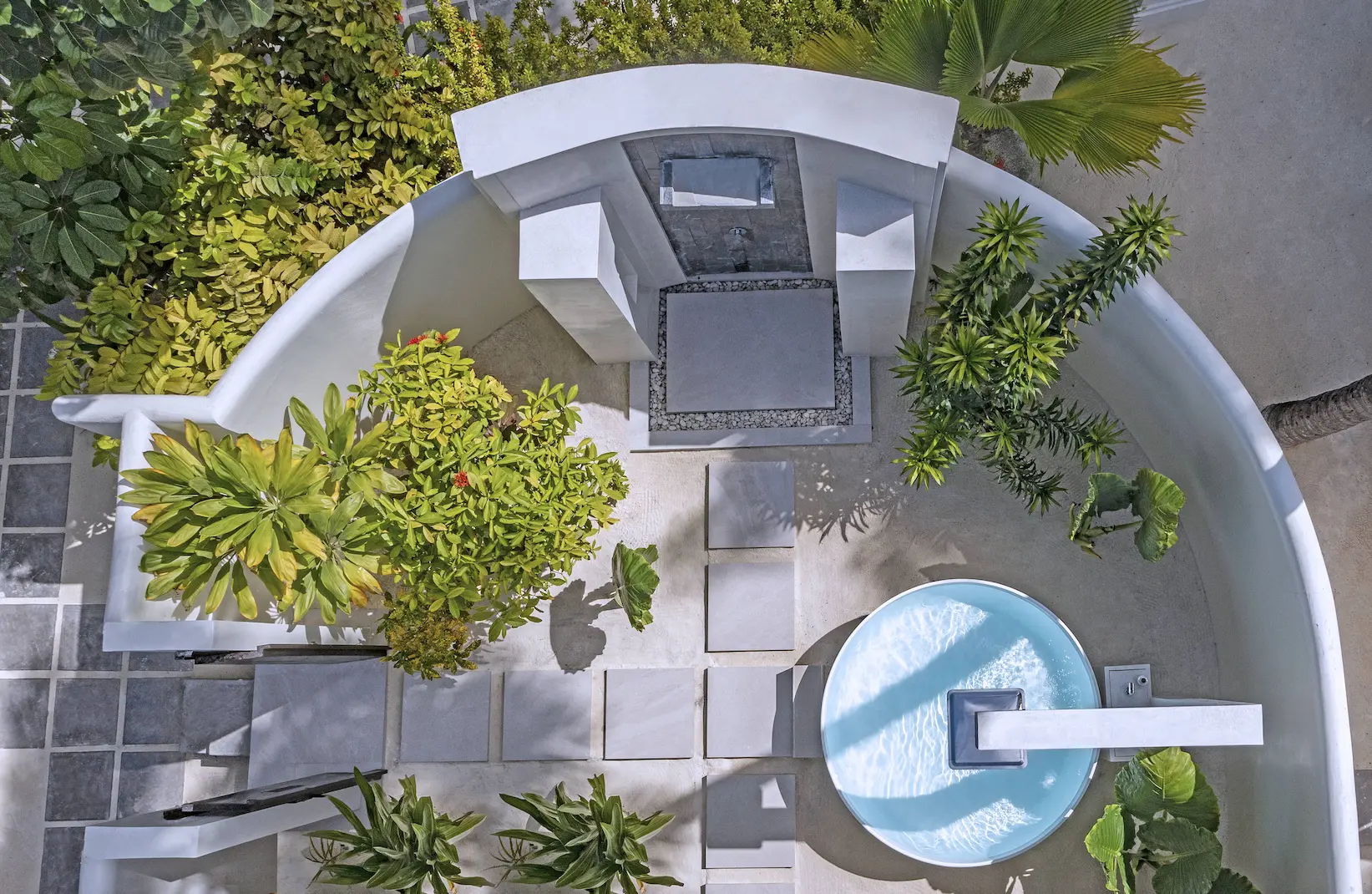 aerial view of the twin bathroom in the two bedroom family beach pool villa at anantara kihavah maldives villas showcasing its open, tranquil coastal layout