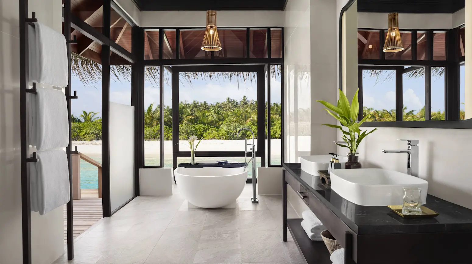 deluxe overwater villa bathroom at anantara veli maldives resort featuring soothing lagoon views and elegant island design