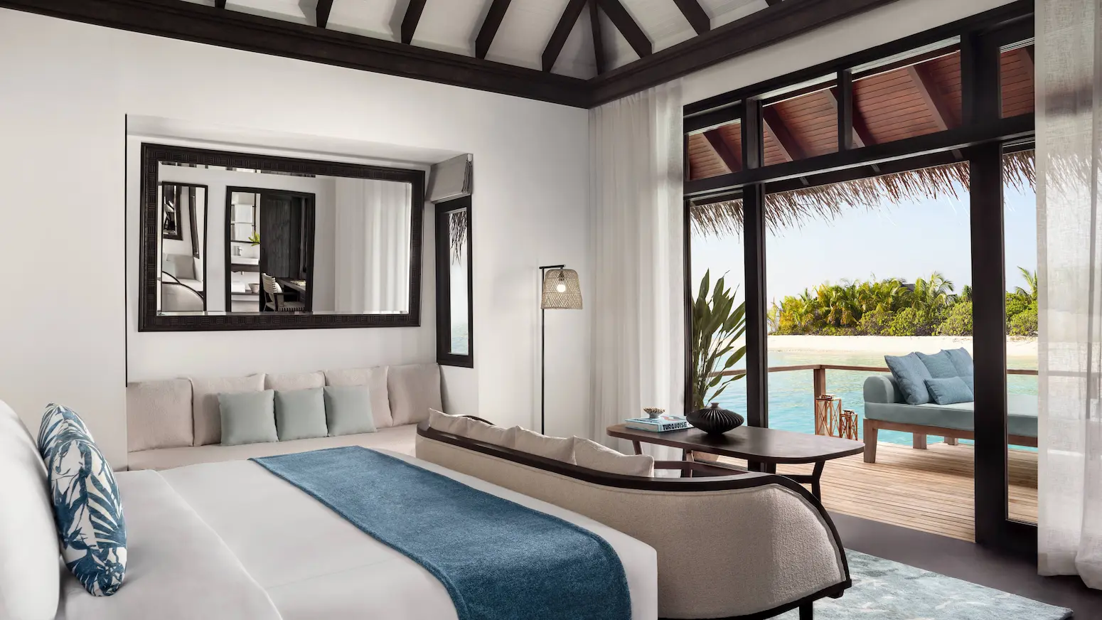 deluxe overwater villa bedroom at anantara veli maldives resort featuring tranquil lagoon views and serene island ambience