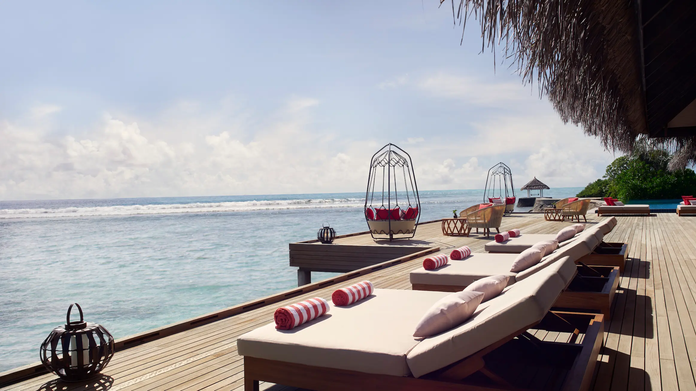 dhoni bar deck at anantara veli maldives resort overlooking calm turquoise waters with a relaxed island atmosphere