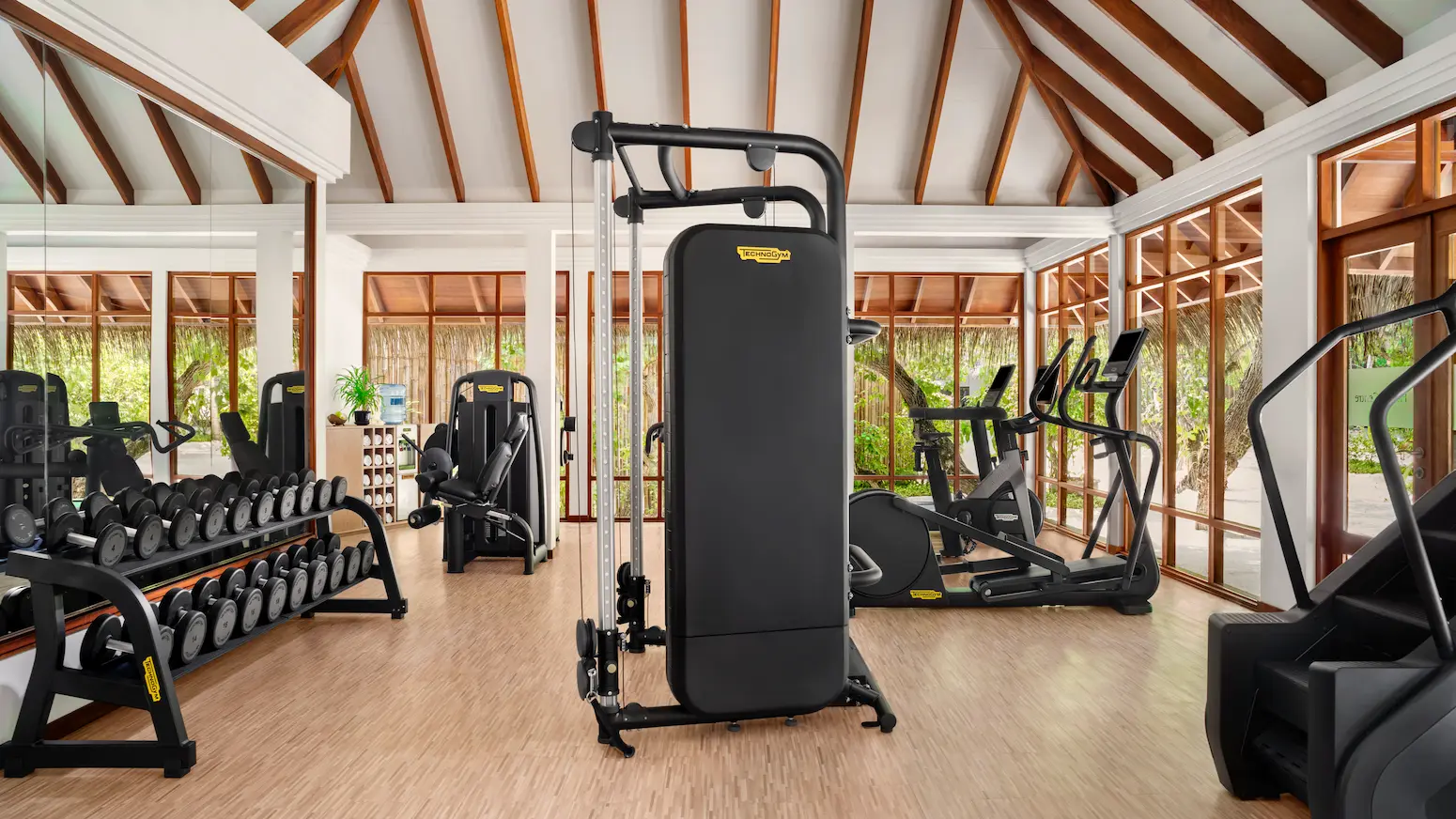 modern health club and fitness centre at anantara veli maldives resort featuring bright island light and contemporary wellness equipment