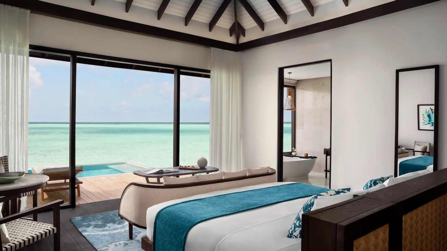 overwater pool villa bedroom at anantara veli maldives resort featuring serene lagoon views and calming island ambience