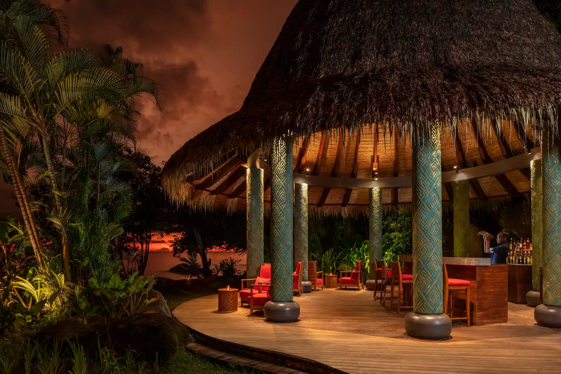 "pool bar at Anantara Maia Seychelles Villas with swim-up seating and tropical surroundings near the infinity pool overlooking the ocean