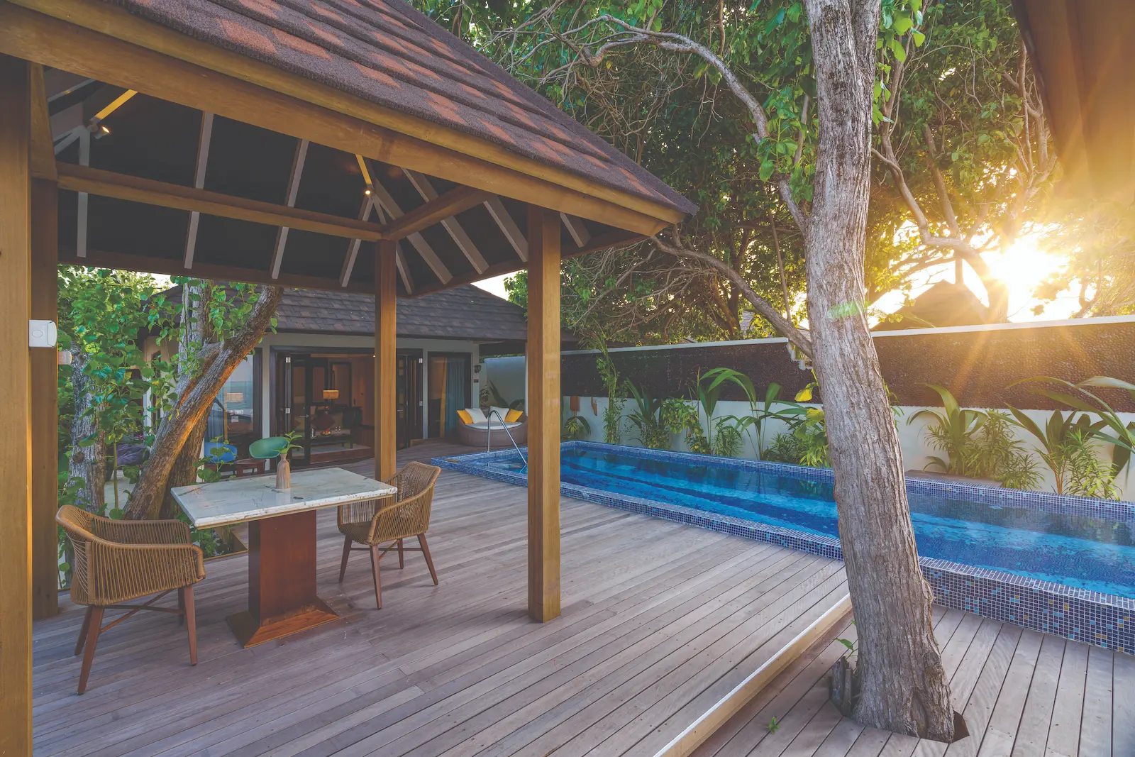 relaxing poolside setting at kani grand villa atmosphere kanifushi maldives