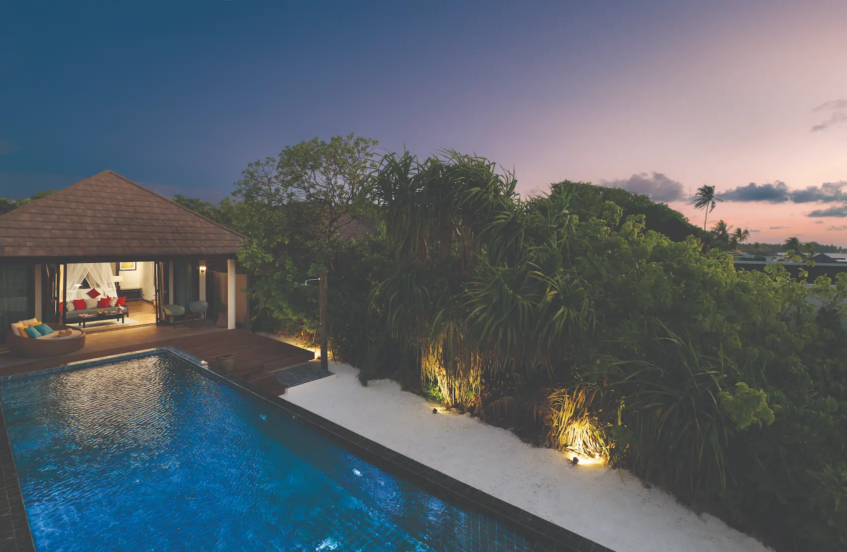 sunset front exterior view of the kanifushi beach villa with private pool atmosphere kanifushi maldives