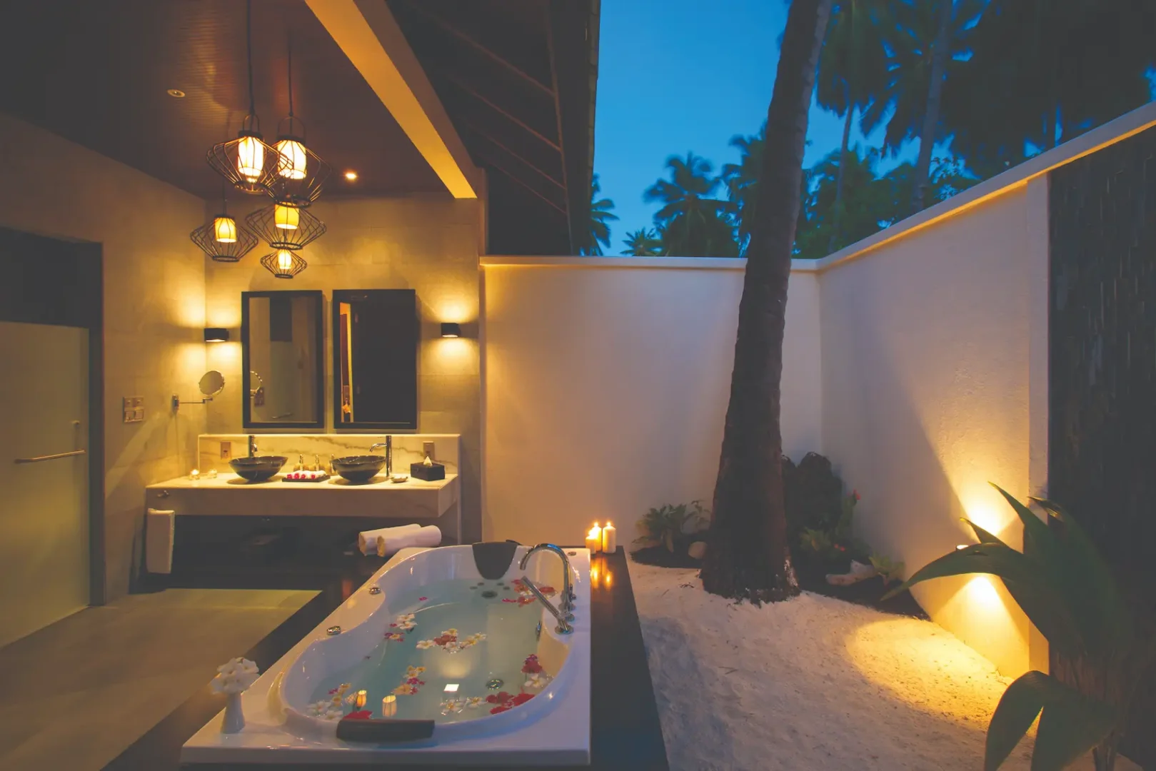 elegant sunset beach villa bathroom setting atmosphere kanifushi maldives