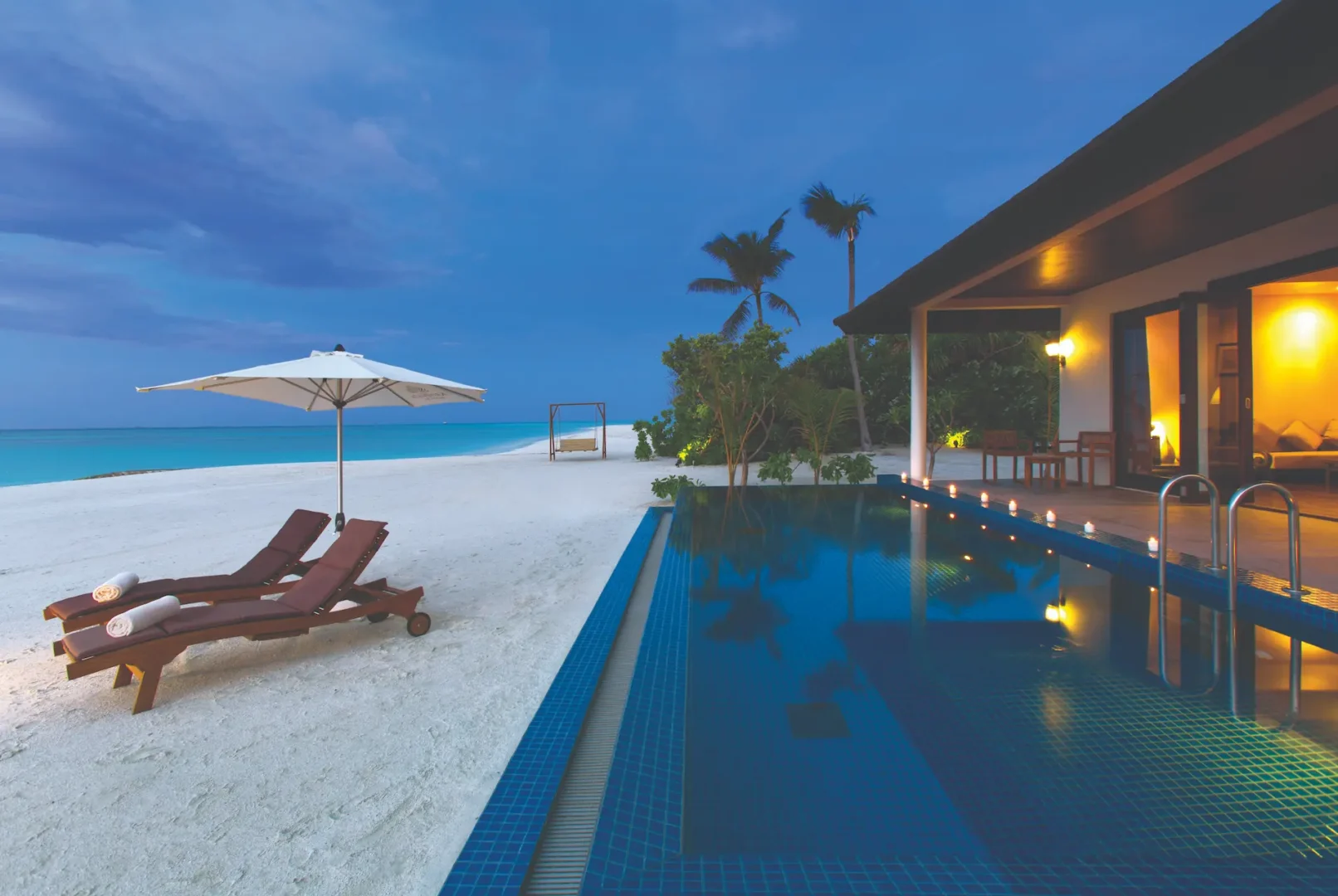 refined sunset pool villa exterior setting atmosphere kanifushi maldives