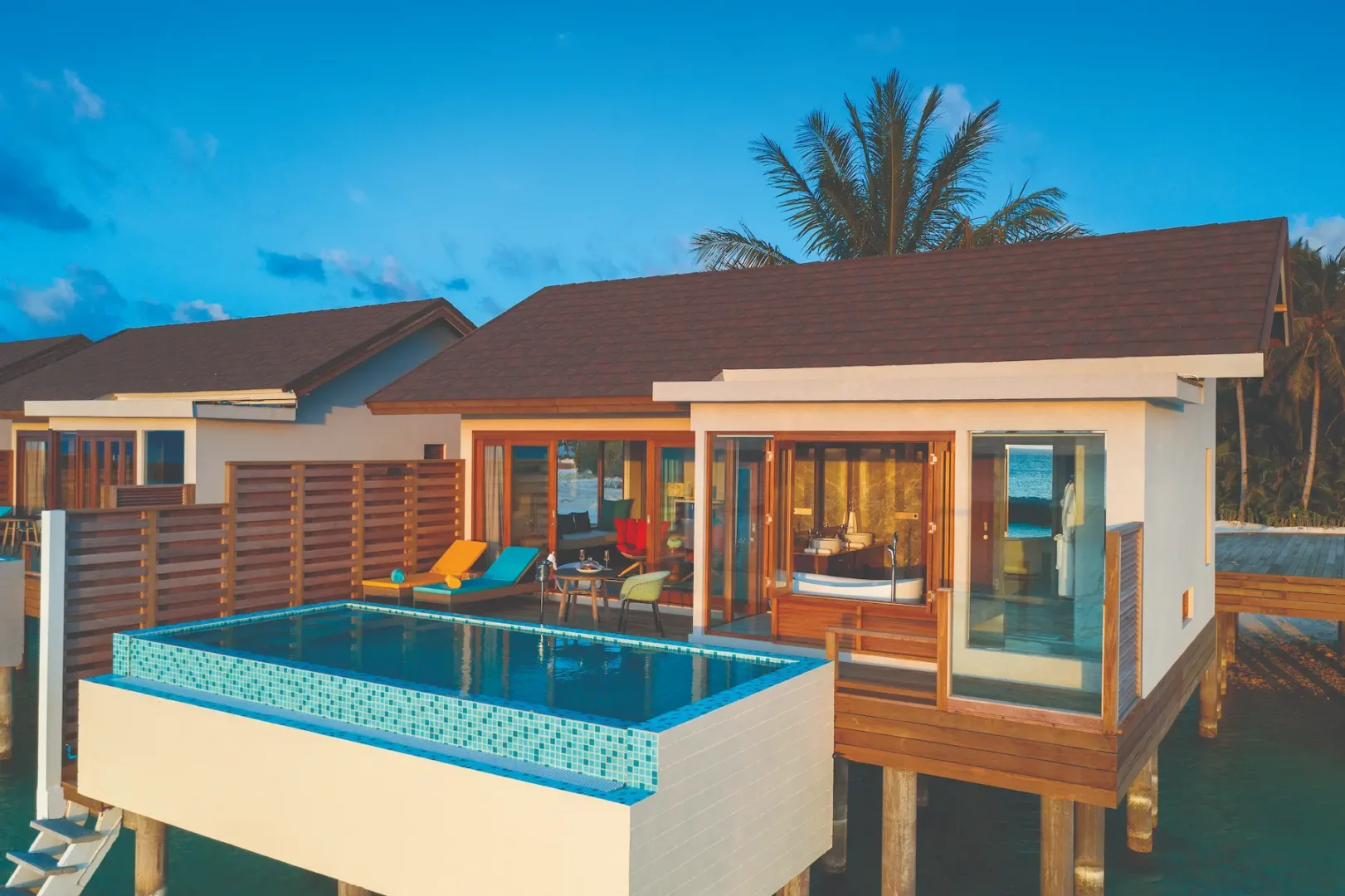 stylish water villa with private pool exterior facing the lagoon atmosphere kanifushi maldives