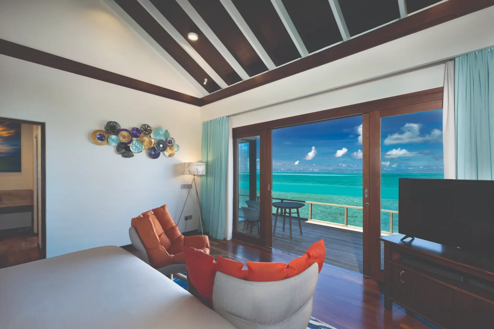 serene water villa bedroom with sweeping ocean view atmosphere kanifushi