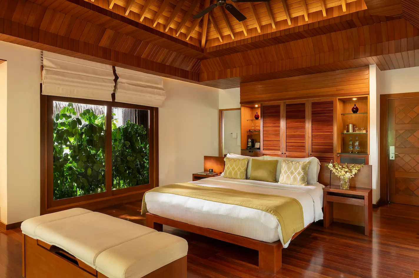 interior of the baros pool villa at baros maldives with elegant island design and warm natural textures