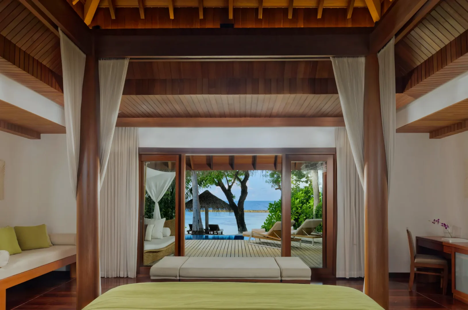 view from the baros pool villa at baros maldives overlooking the private pool and turquoise lagoon