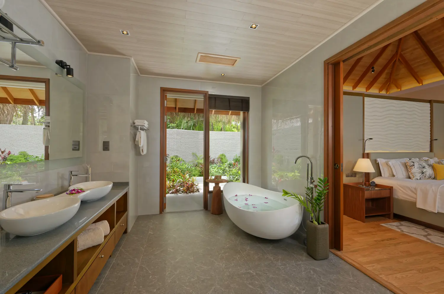 bathroom of the baros residence at baros maldives with elegant island styling and soft natural light