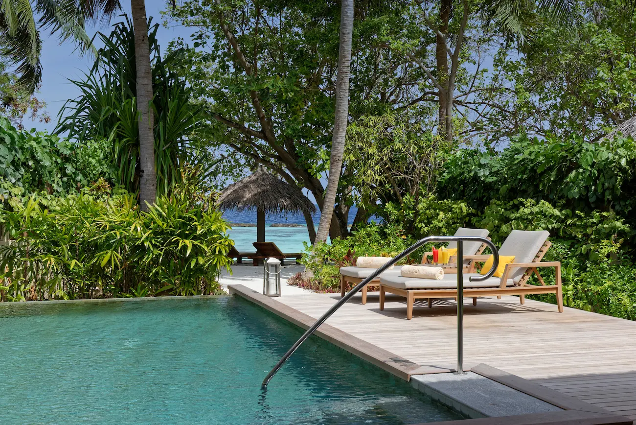 private pool of the baros residence at baros maldives overlooking the clear turquoise lagoon