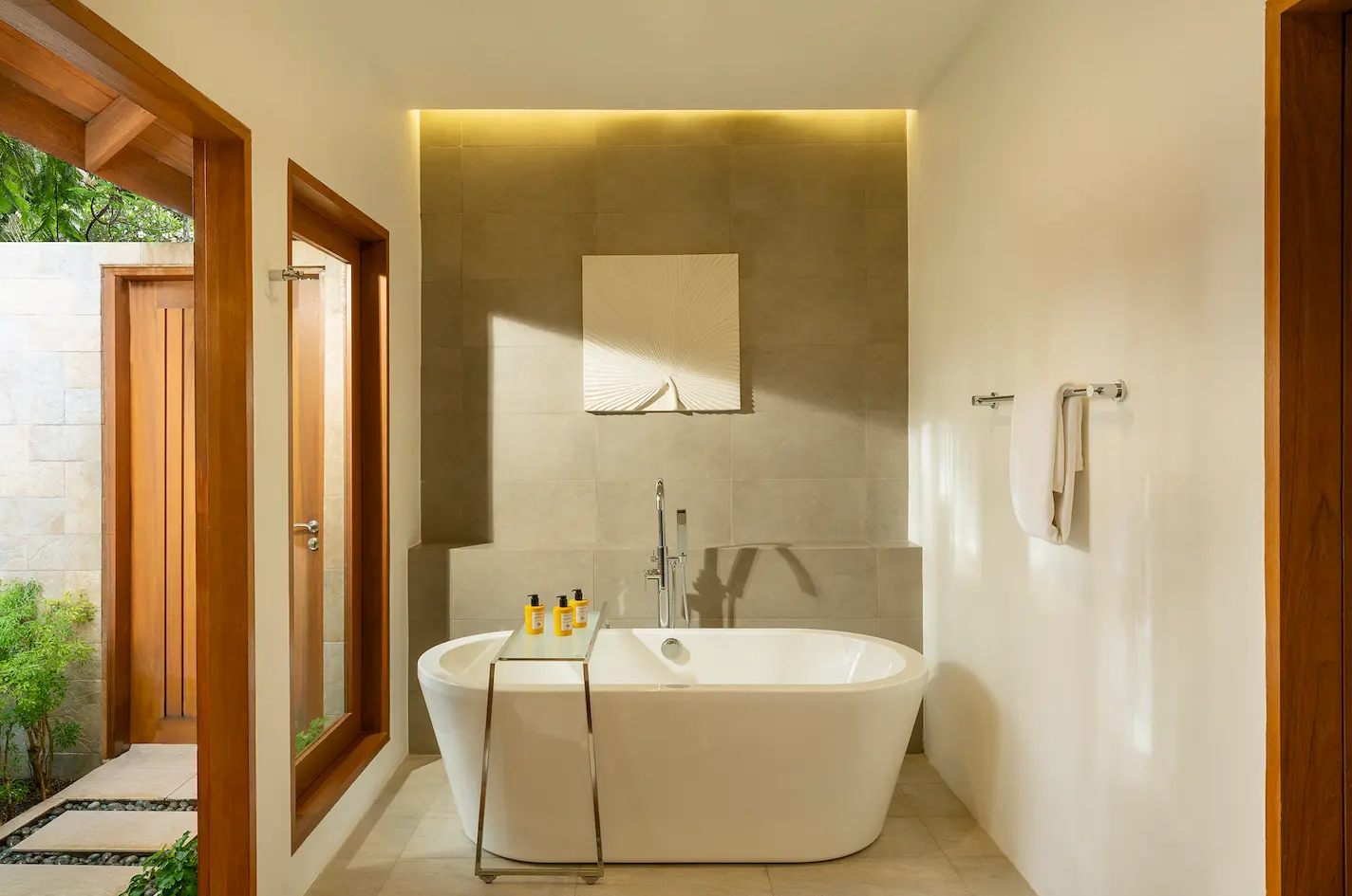 bathtub in the baros suite at baros maldives with elegant island styling and soft natural light