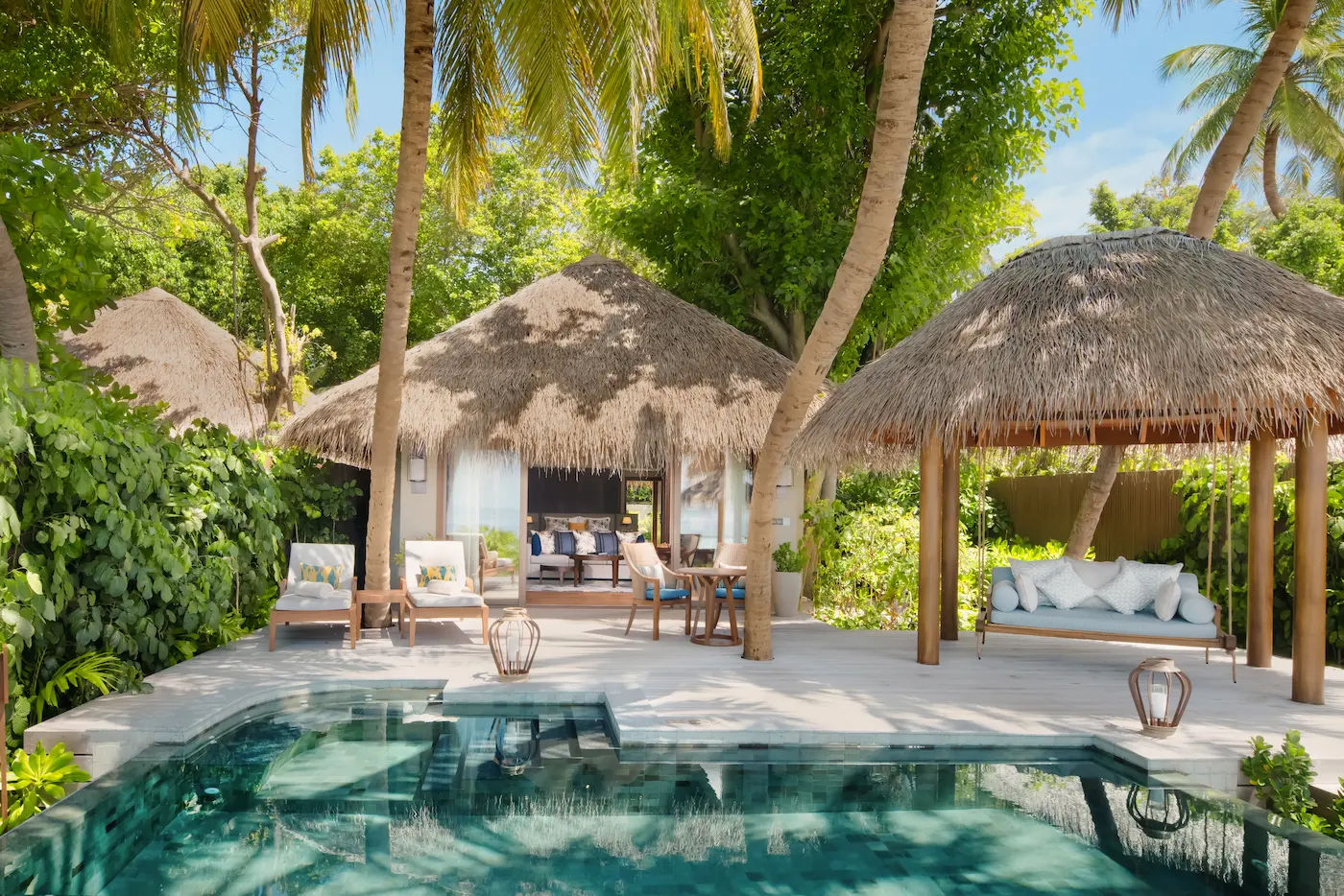 exterior of the baros suite at baros maldives showcasing contemporary island architecture beside the lagoon