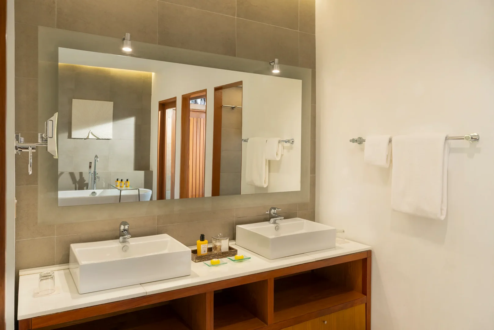 double sink bathroom of the baros villa at baros maldives with elegant island styling and calm natural light
