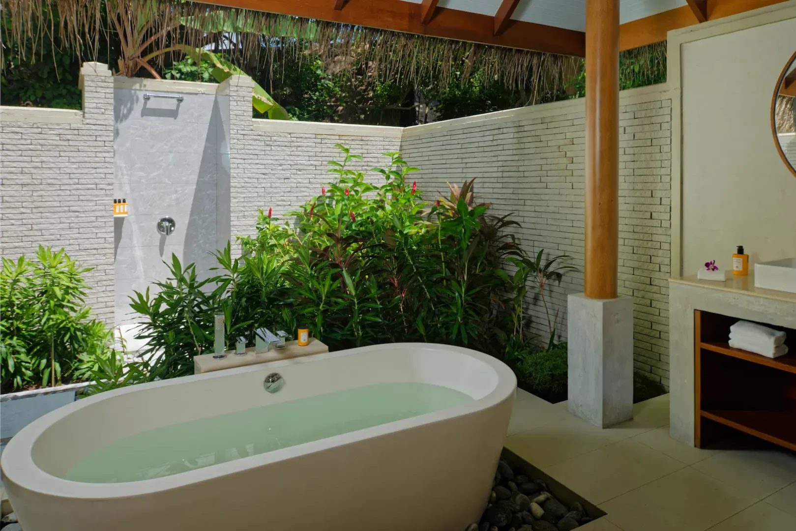 bathroom of the deluxe villa at baros maldives with elegant island design and calming natural light