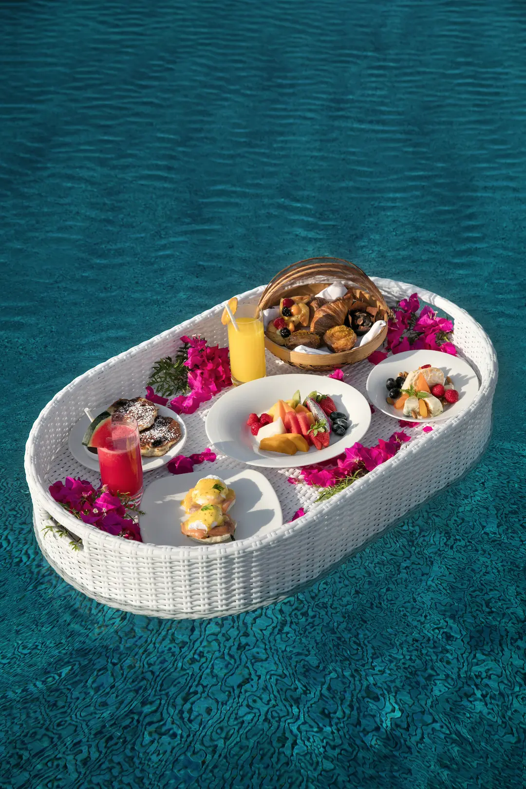 floating breakfast at baros maldives served on a private pool tray with serene island ambience
