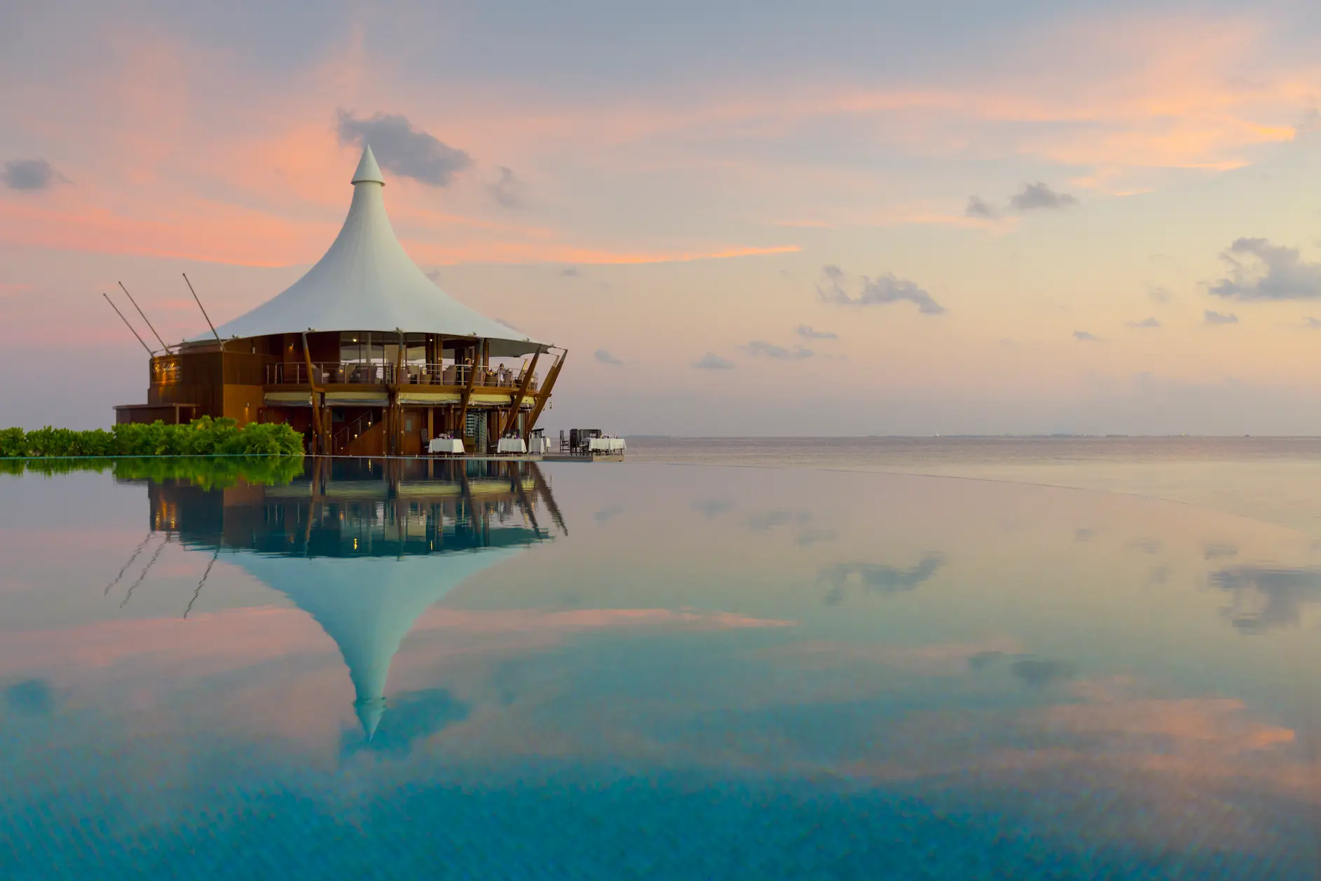 lighthouse restaurant at baros maldives offering elegant overwater dining with lagoon views
