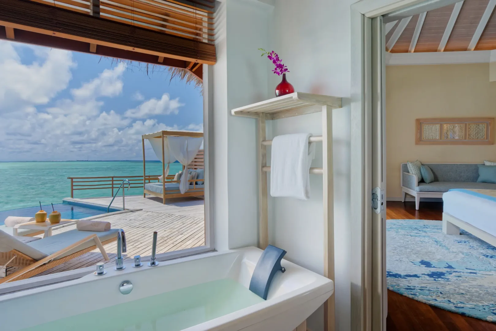 bathroom of the water pool villa at baros maldives with elegant island styling and serene natural light