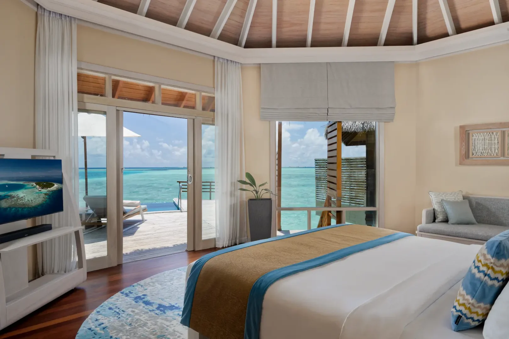 view from the water pool villa at baros maldives overlooking the private pool and turquoise lagoon