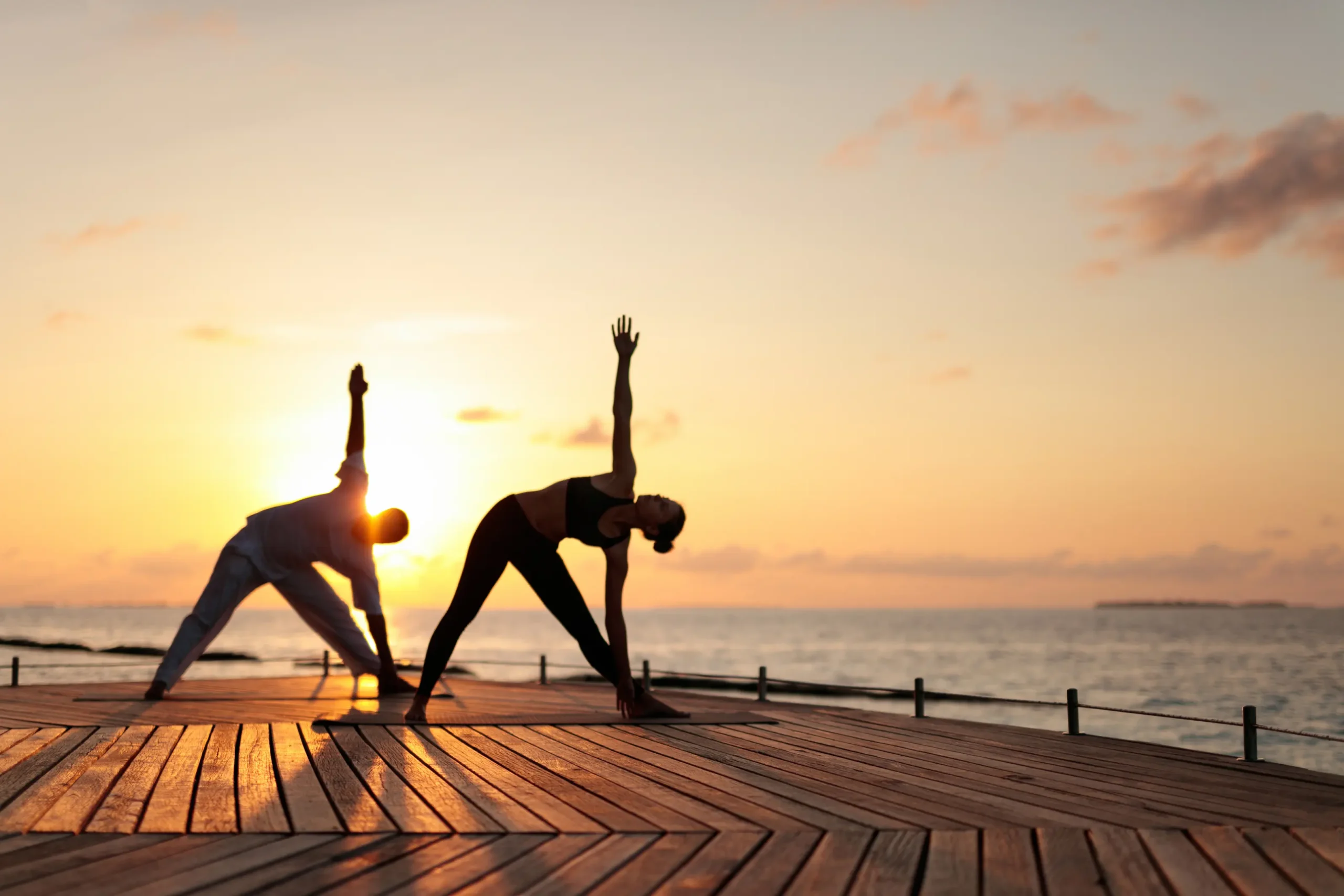 yoga session at baros maldives with calm island surroundings and gentle natural light