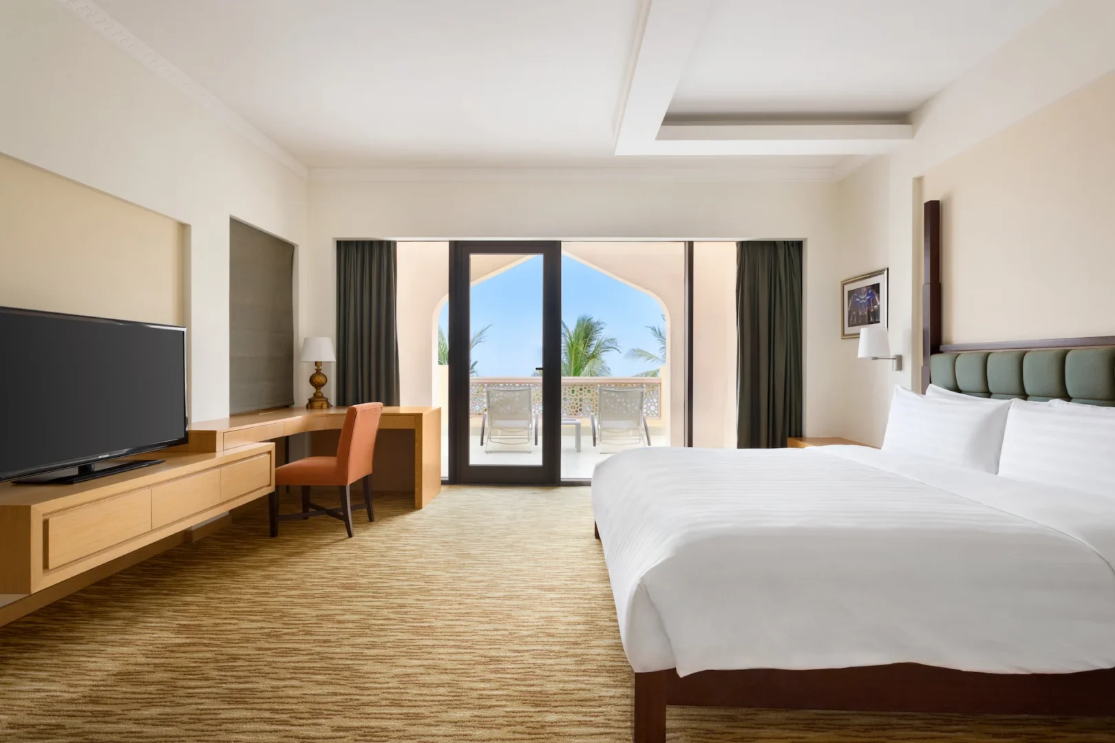 interior of one bedroom suite bedroom with sea view at hilton muscat al bandar oman resort