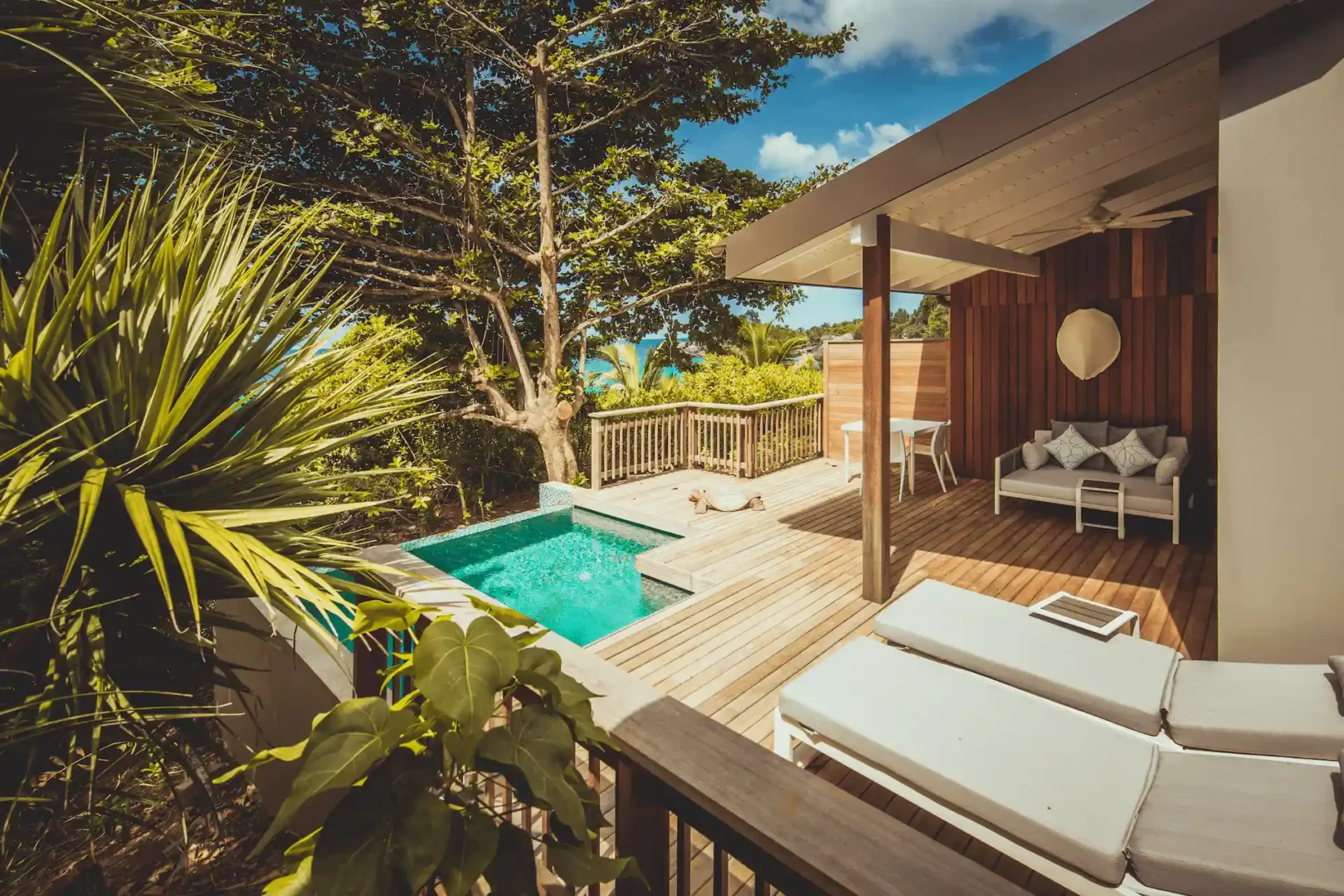 carana beach hotel ocean view pool chalet exterior with private pool, terrace, and views of turquoise sea surrounded by tropical gardens