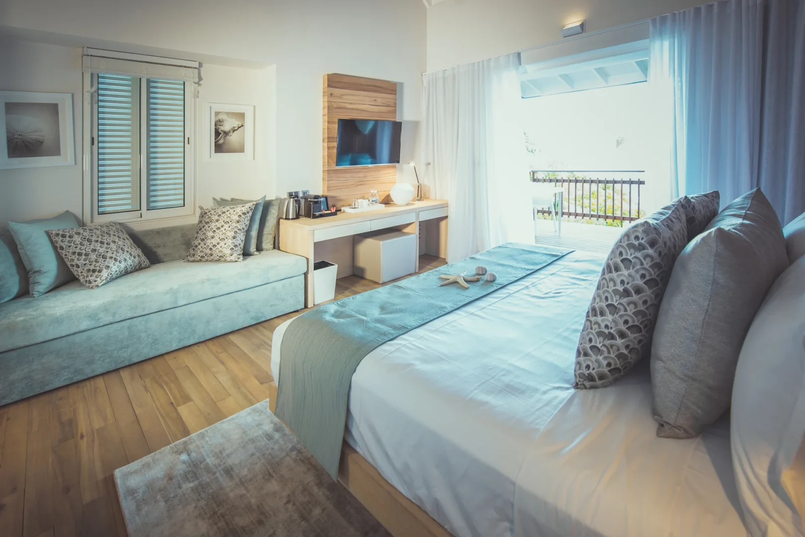 carana beach hotel ocean view pool chalet interior with modern furnishings, open living space, and windows overlooking private pool and turquoise sea