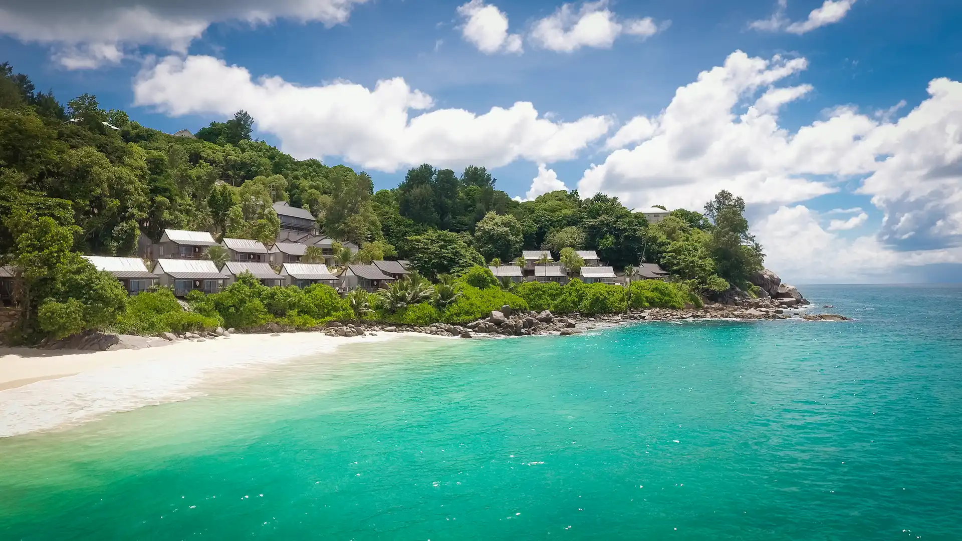 carana beach hotel seychelles with pristine white sand beach turquoise ocean clear waters