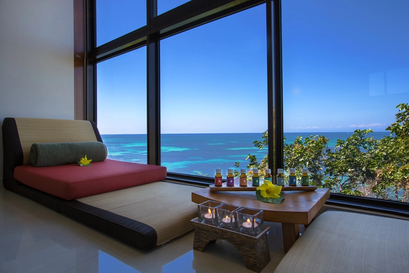 coco de mer seychelles beach chair with ocean views, soft sand setting, and tropical palm surroundings