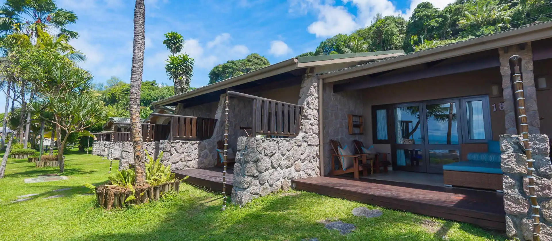 coco de mer seychelles superior room exterior with private terrace, lush tropical gardens, and ocean views