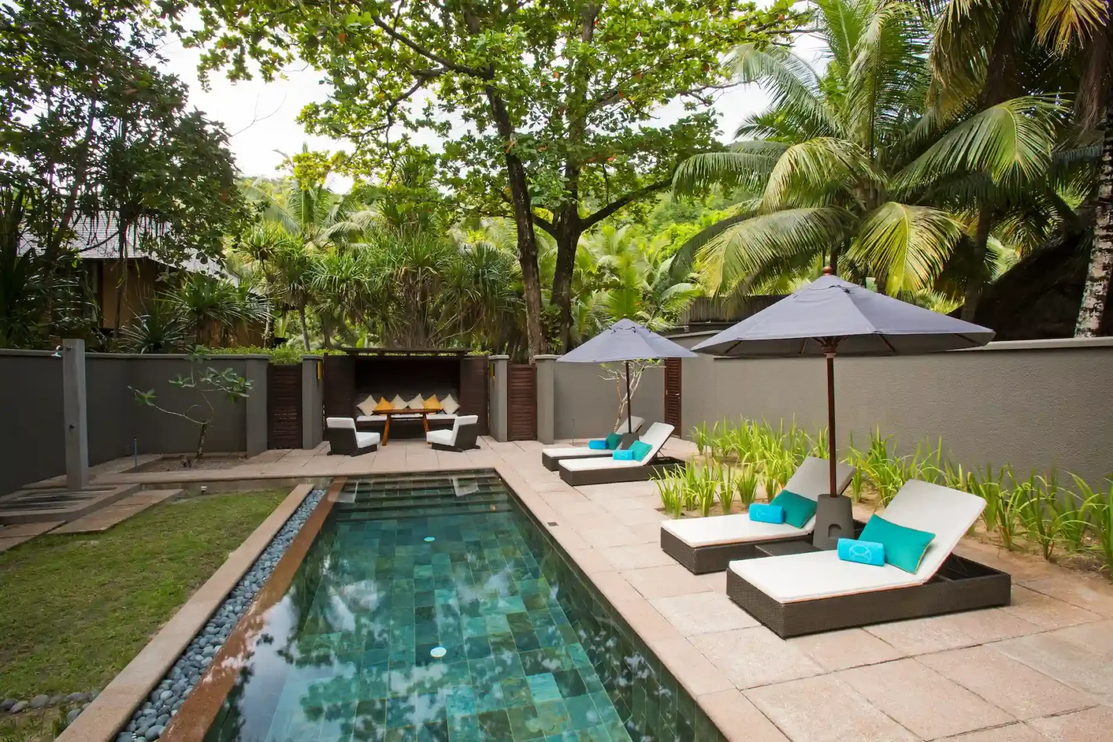 constance ephelia beach villa pool lounge with sun loungers
