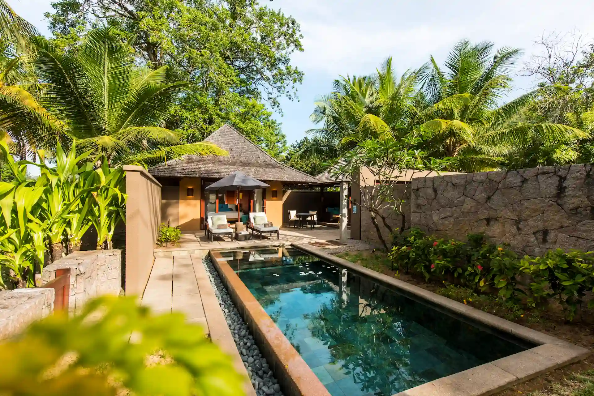 constance ephelia beach villa pool view with turquoise water