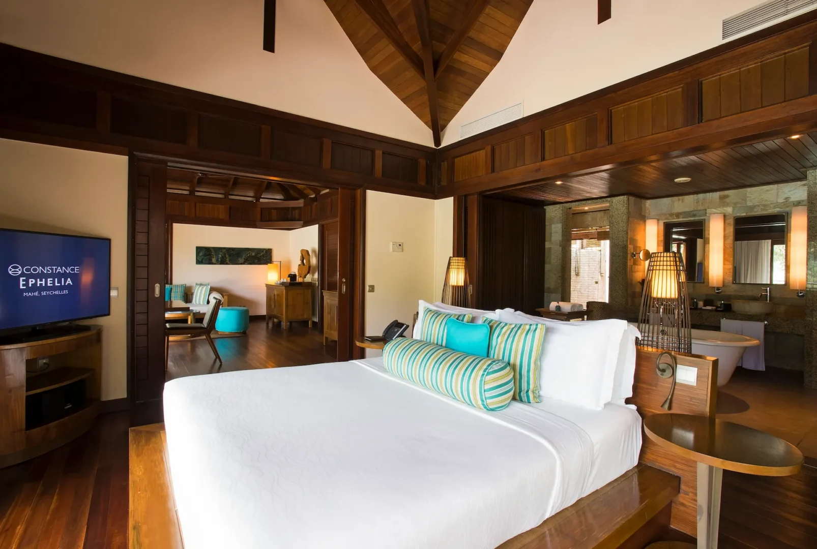 constance ephelia hillside villa bedroom with king bed and tropical decor