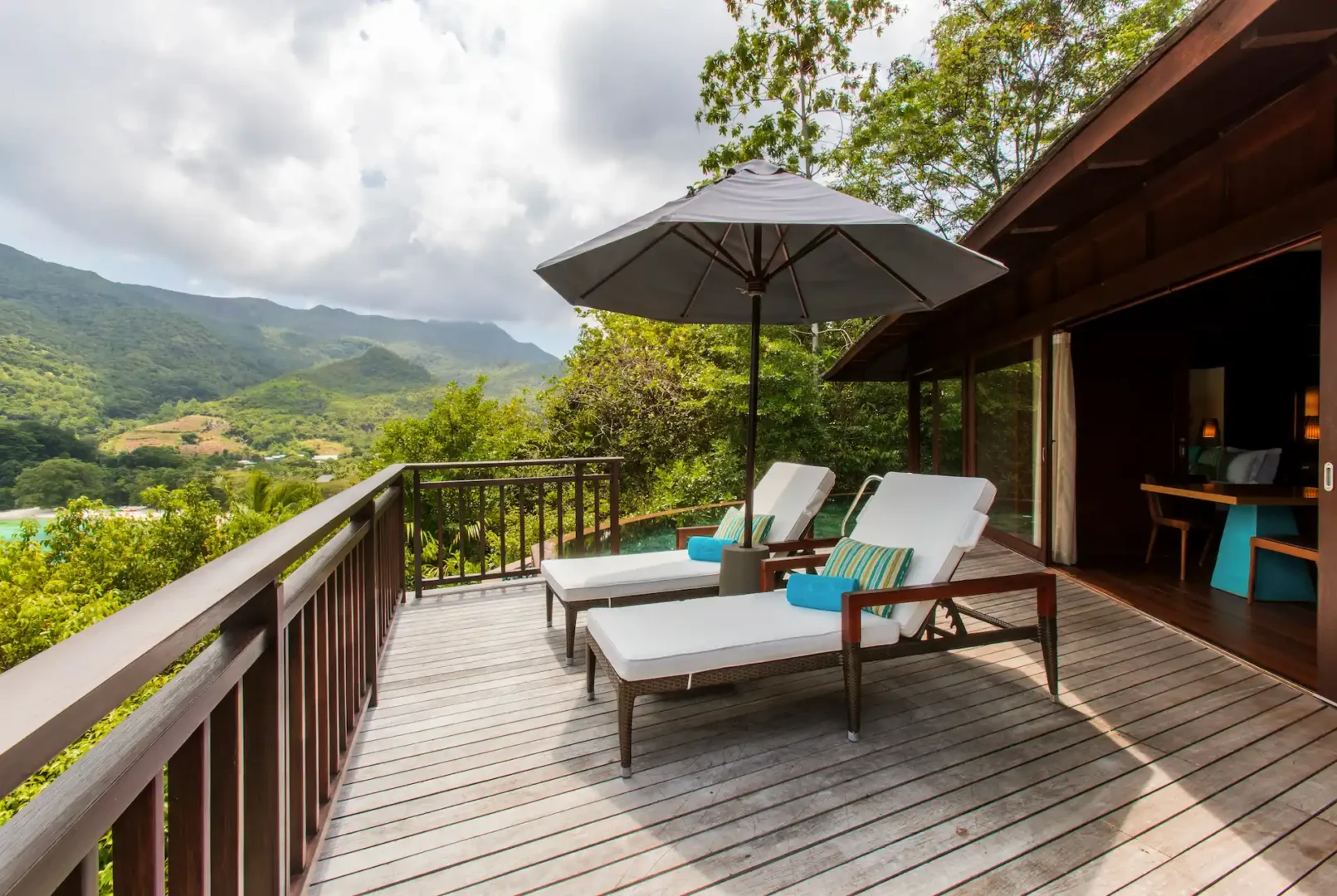 constance ephelia hillside villa sun loungers with tropical garden and pool view