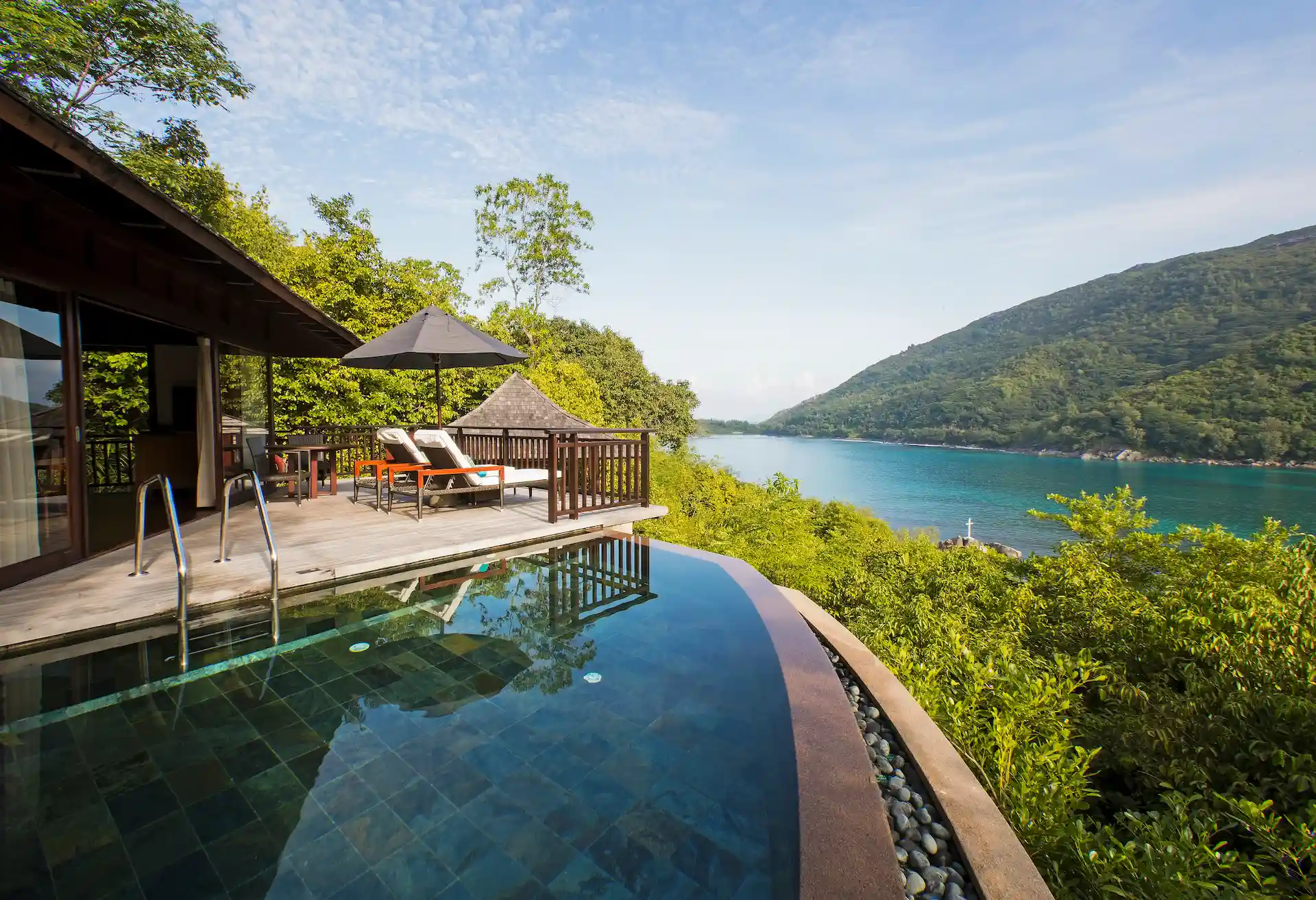 constance ephelia hillside villa pool view with turquoise water