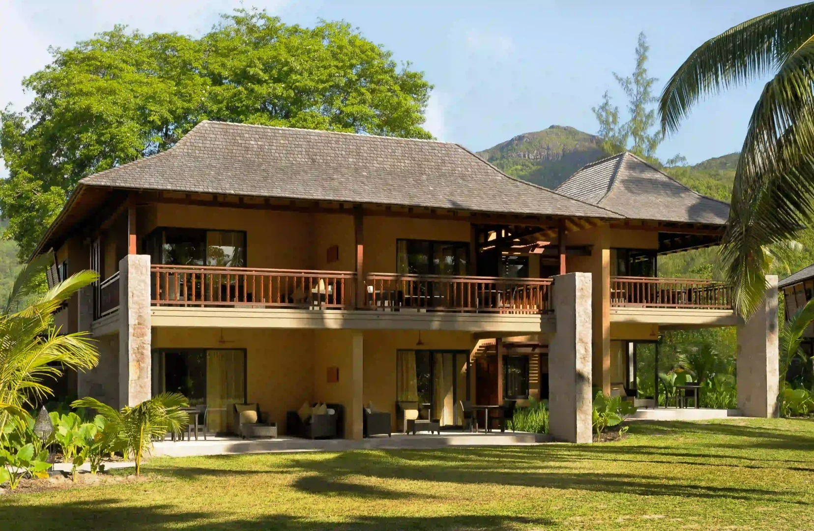 constance ephelia junior suite with bedroom living area and tropical decor