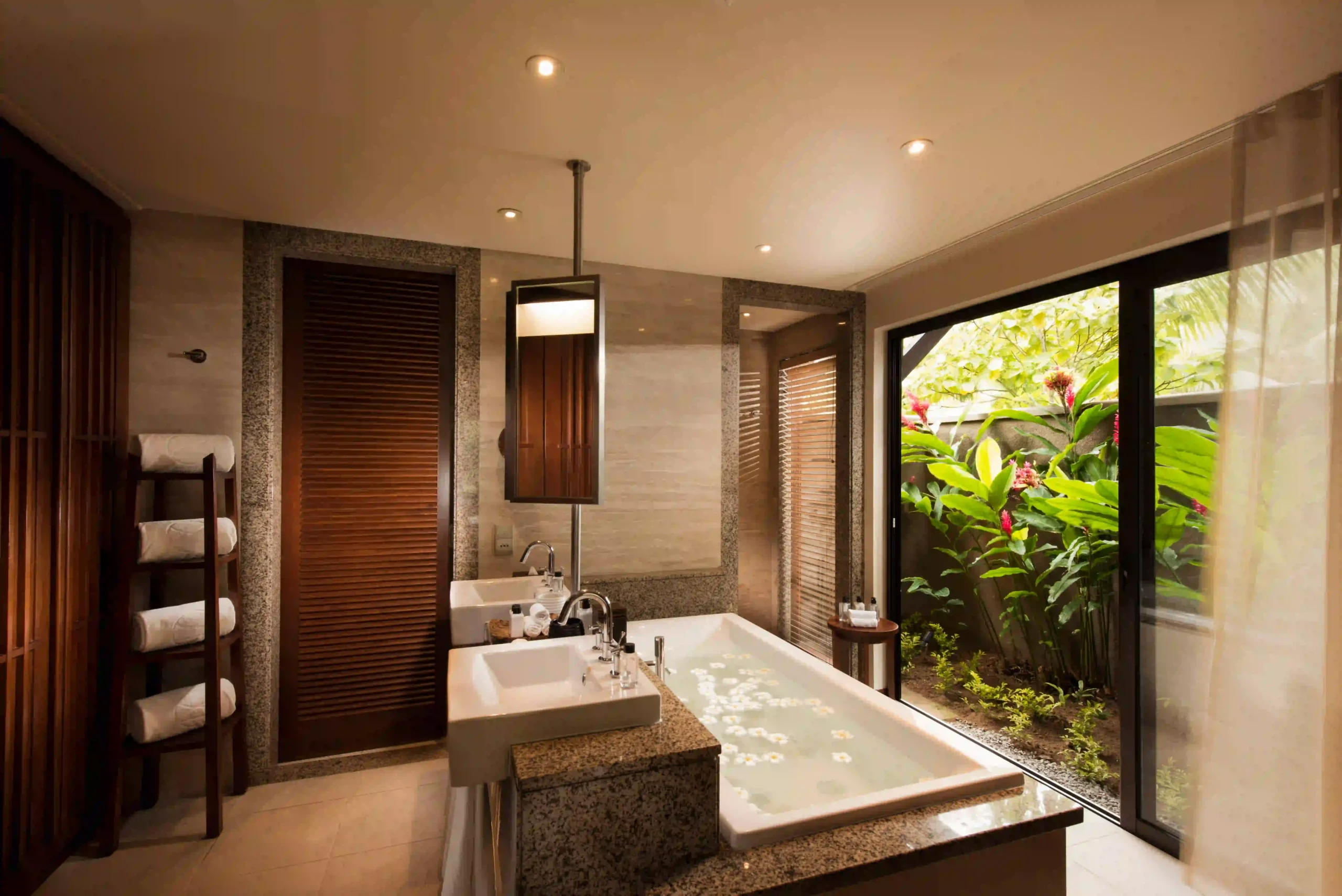 constance ephelia junior suite bathroom with elegant fixtures and tropical decor