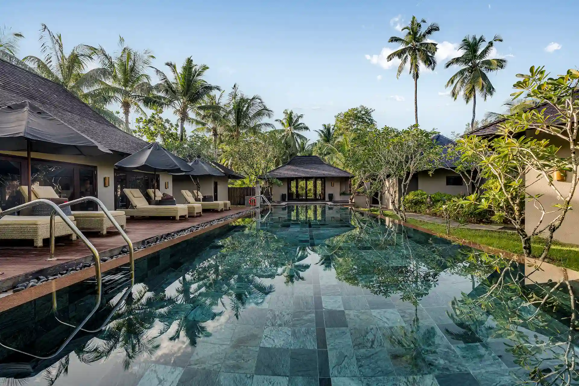 constance ephelia seychelles pool and spa area with sun loungers