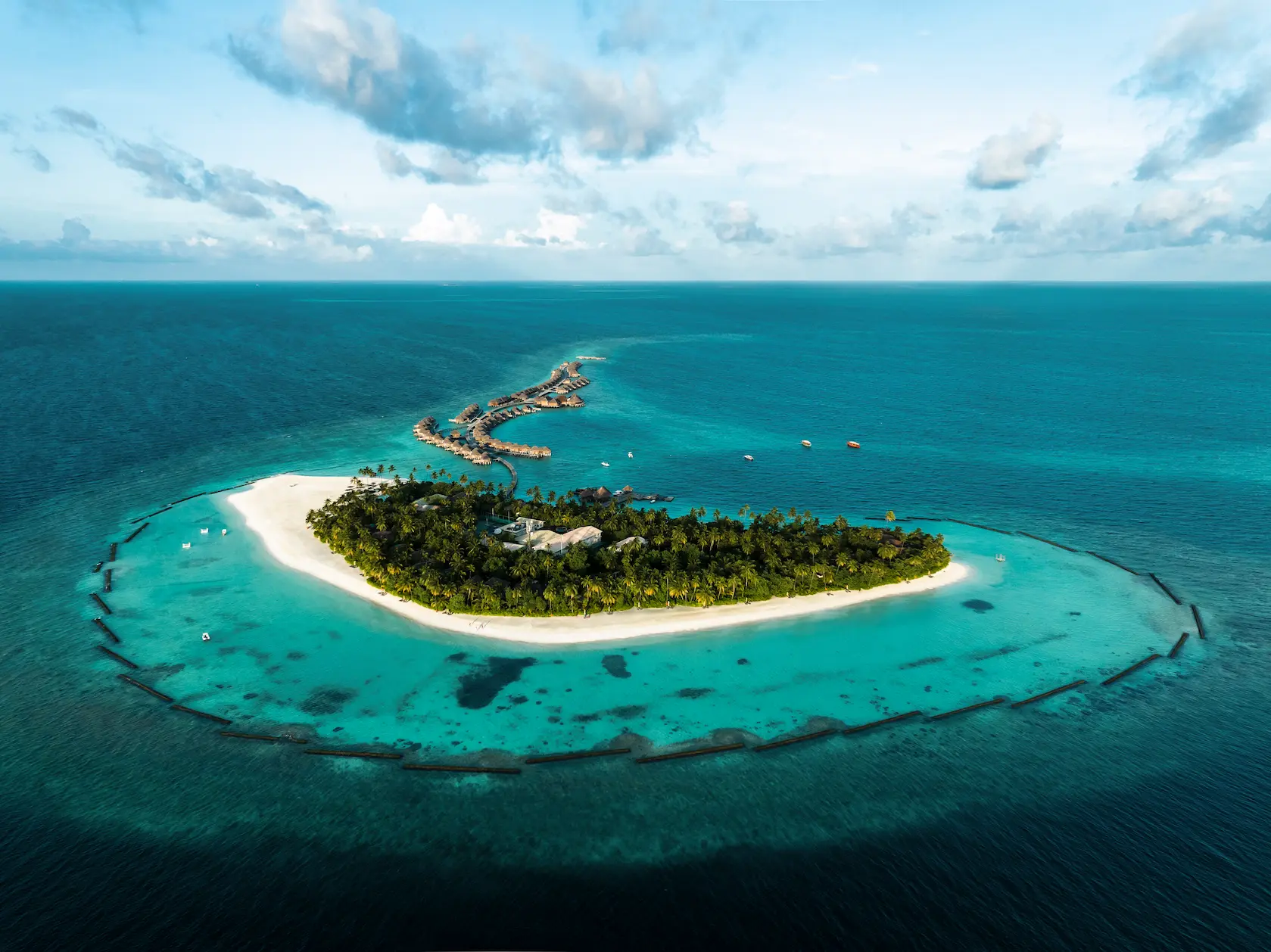 constance halaveli maldives aerial island view over the lagoon