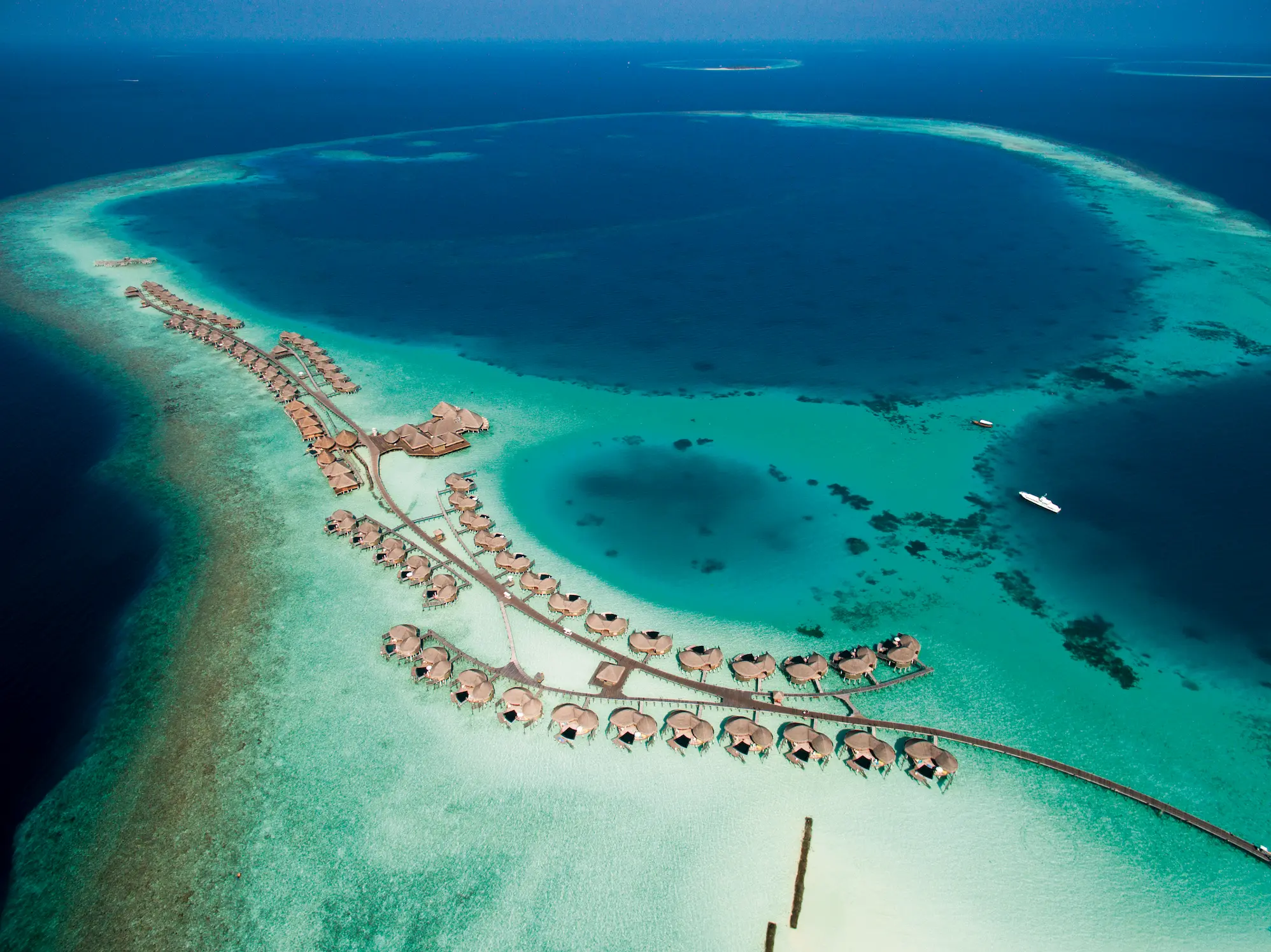constance halaveli maldives aerial view of the island and lagoon
