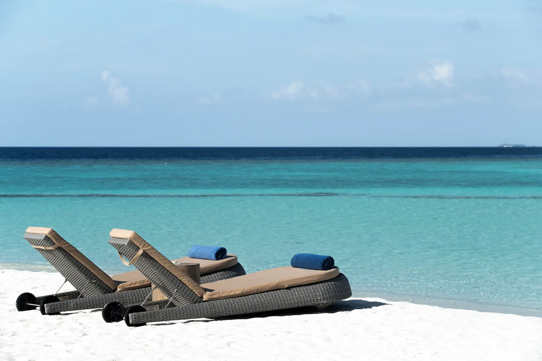 constance halaveli maldives beach scene with a calm shoreline setting