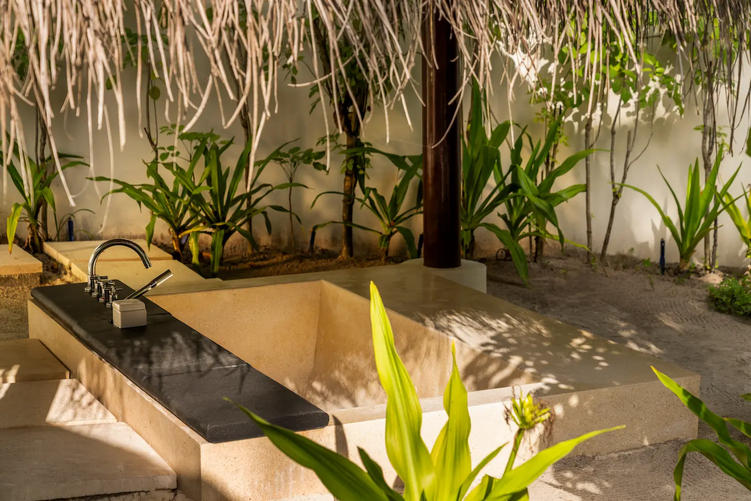 constance halaveli maldives beach villa featuring a stylish bath area