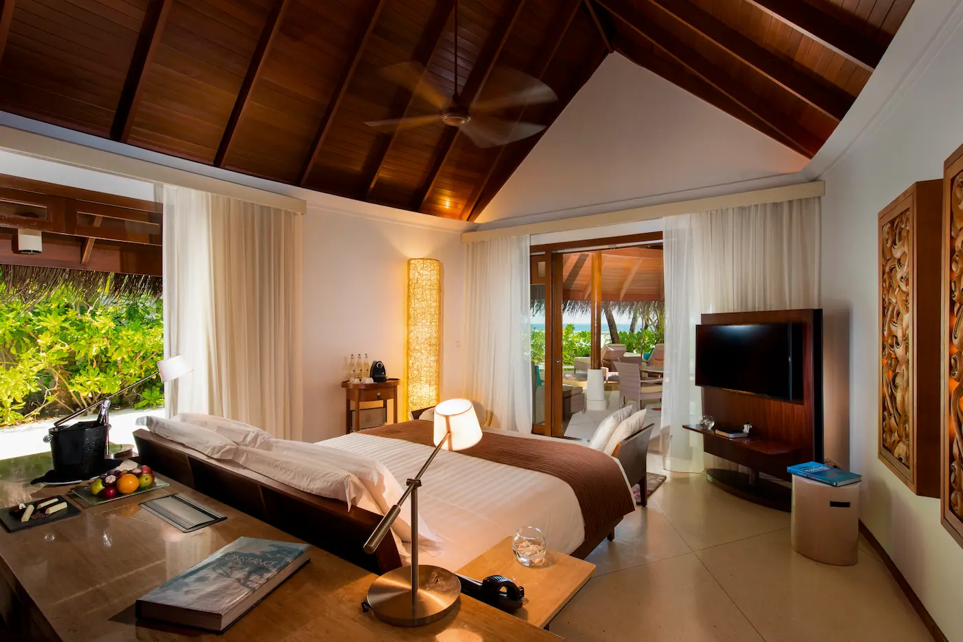 constance halaveli maldives beach villa bedroom featuring a comfortable bed in a relaxing setting