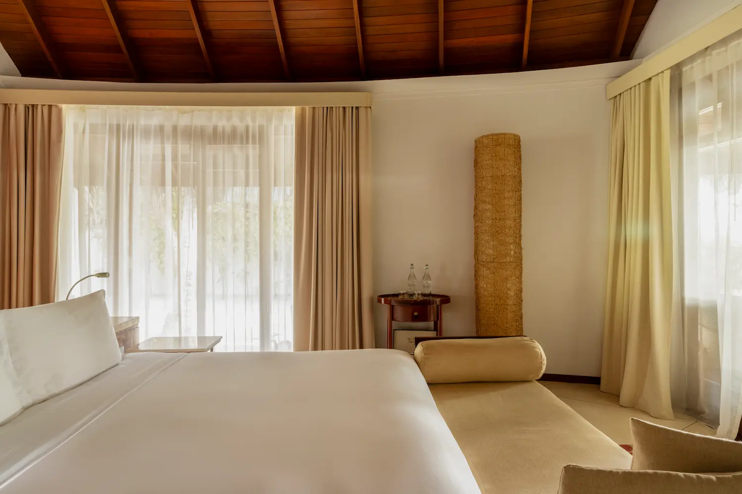 constance halaveli maldives beach villa bedroom offering a calm and spacious setting